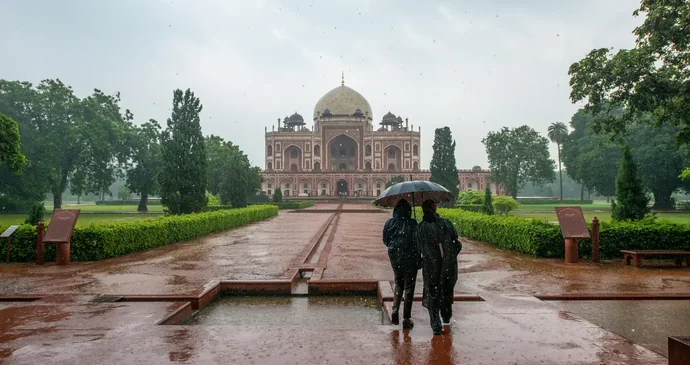 Couple photographed with the Taj Mahal at sunset