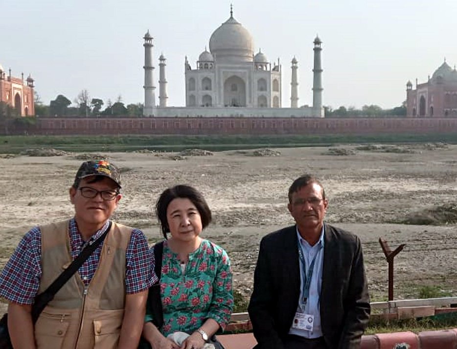 Travelers shopping for handicrafts with their guide